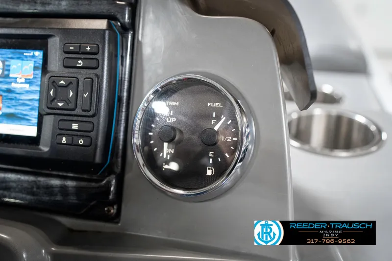 Slide: The Image of Control panel of 2023 Avalon 2380 VLS boat with fuel and trim gauges. - 40