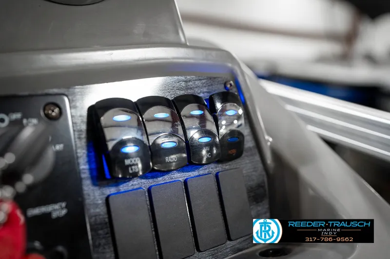 Slide: The Image of Control panel of 2023 Avalon 2380 VLS boat with illuminated switches. - 41