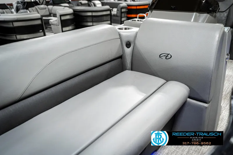 Slide: The Image of 2023 Avalon 2380 VLS boat interior with gray seating and logo detail. - 43