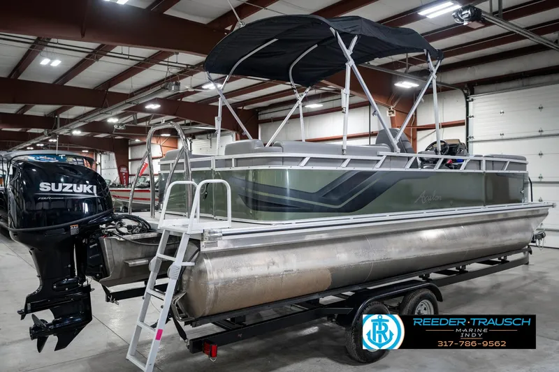 Slide: The Image of 2023 Avalon 2380 VLS pontoon boat with Suzuki outboard motor in indoor showroom. - 8
