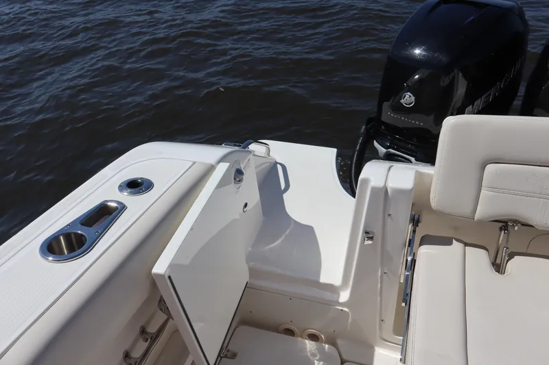 Slide: The Image of 2023 Boston Whaler 350 Realm boat deck with open door and engine view. - 26