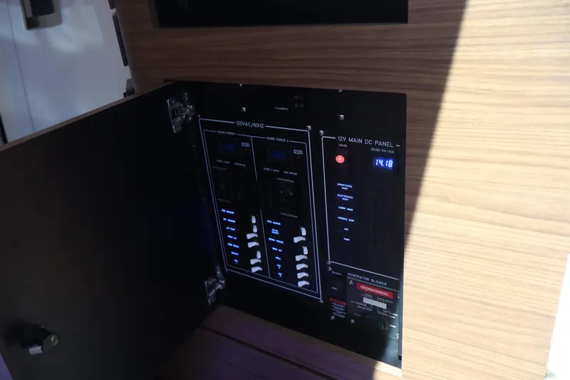 Slide: The Image of Electrical panel inside 2023 Boston Whaler 350 Realm boat, showcasing control switches. - 33