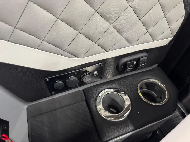 Slide: The Image of Interior of 2025 Godfrey AquaPatio 255 ULC with quilted upholstery and dual cup holders. - 10