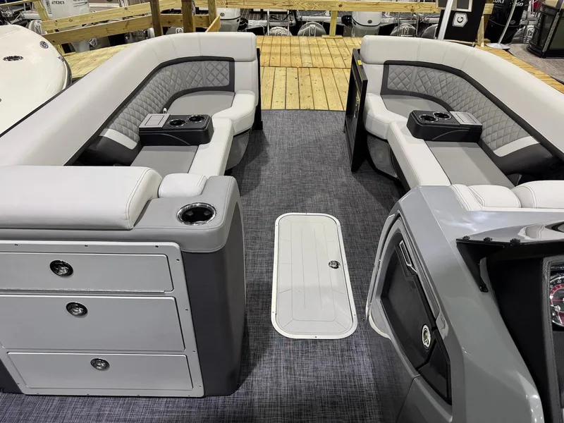Slide: The Image of Interior of 2025 Godfrey AquaPatio 255 ULC pontoon boat with luxurious seating and storage. - 7