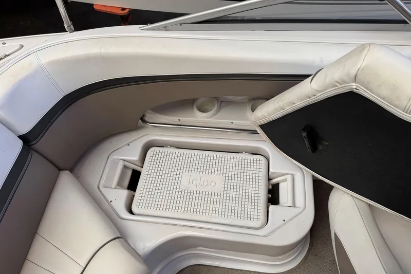 Slide: The Image of 2004 Four Winns 210 Horizon boat interior with built-in Igloo cooler. - 14