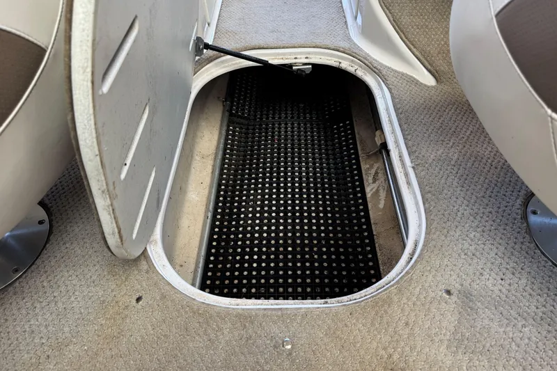 Slide: The Image of Storage compartment in 2004 Four Winns 210 Horizon boat interior. - 18