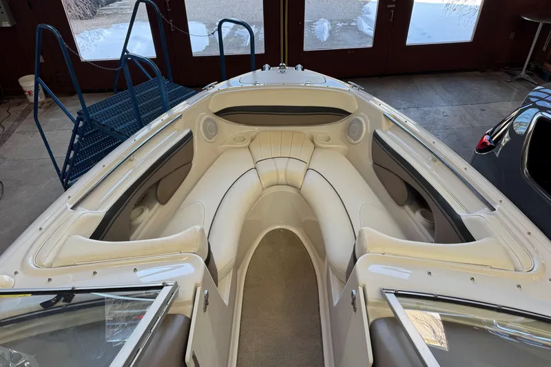 Slide: The Image of 2004 Four Winns 210 Horizon boat interior with white seating and spacious layout. - 7