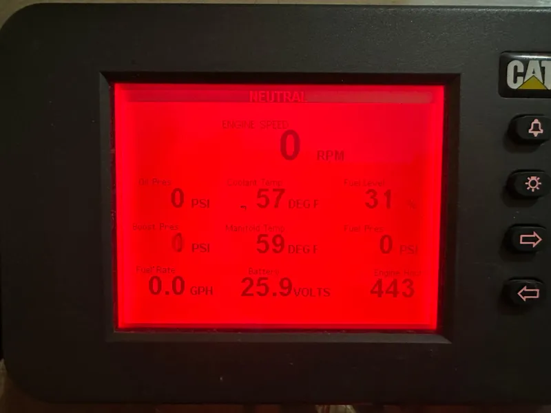 Slide: The Image of Digital display showing engine metrics for a 2006 Cabo 40 Express boat. - 11