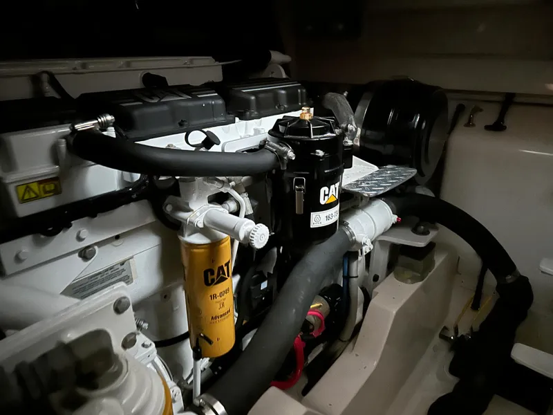 Slide: The Image of Engine compartment of a 2006 Cabo 40 Express boat with CAT components. - 40