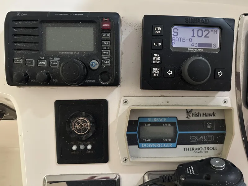 Slide: The Image of Control panel of a 2006 Cabo 40 Express boat with navigation and communication devices. - 8