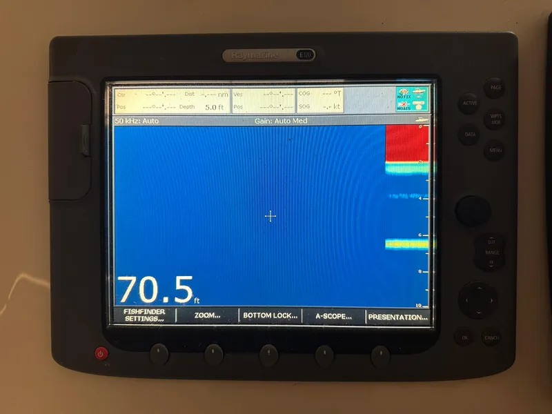 Slide: The Image of Fishfinder display on a 2006 Cabo 40 Express boat, showing depth of 70.5 feet. - 9