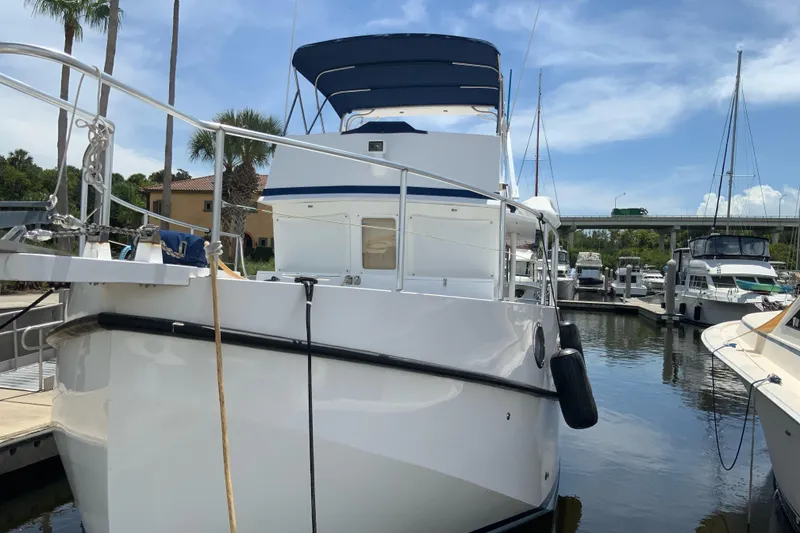 Slide: The Image of 2008 Great Harbour N37 yacht docked at marina under clear blue sky. - 11