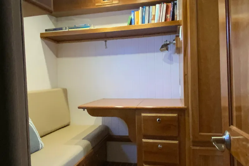 Slide: The Image of Cozy study nook in 2008 Great Harbour N37 boat with wooden desk and shelves. - 12