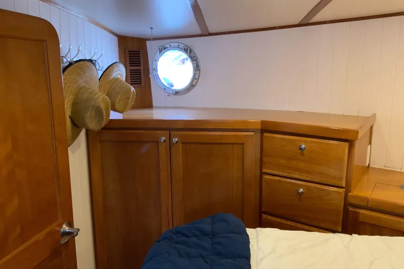 Slide: The Image of Cozy cabin interior of 2008 Great Harbour N37 with wooden cabinets and porthole. - 17