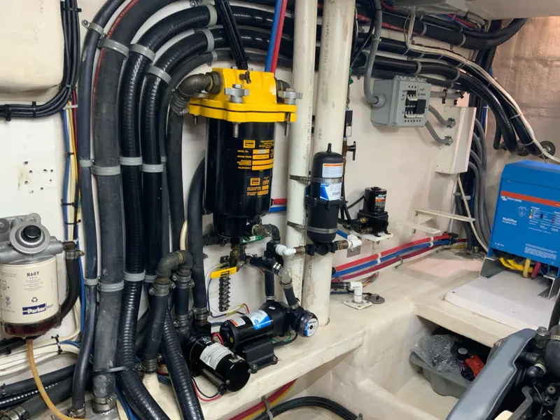 Slide: The Image of Engine room of 2008 Great Harbour N37 with complex piping and filtration system. - 22