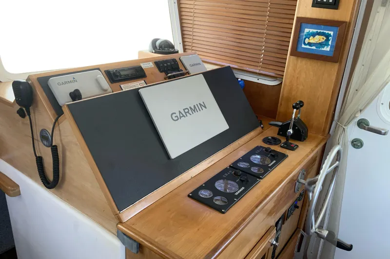 Slide: The Image of Great Harbour N37 2008 helm with Garmin navigation equipment and control panel. - 5