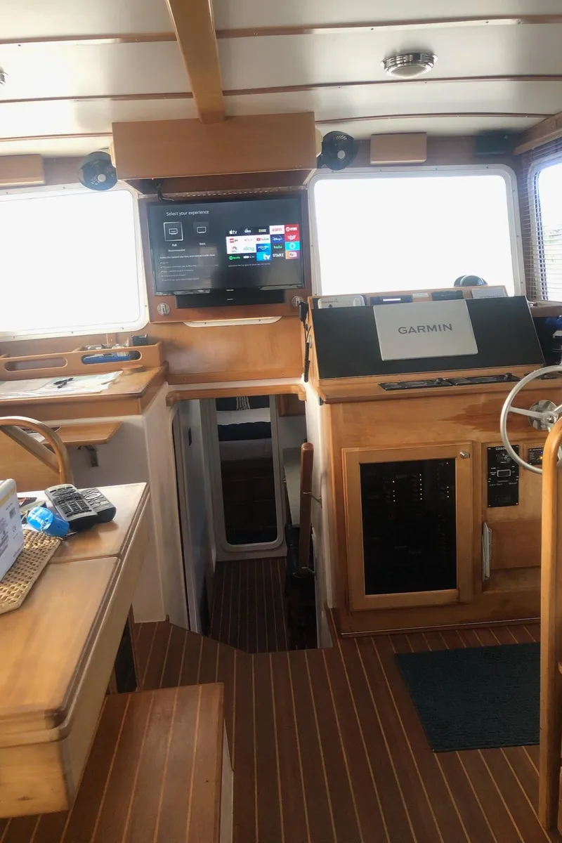 Slide: The Image of Interior of 2008 Great Harbour N37 boat with wooden finish and navigation equipment. - 6
