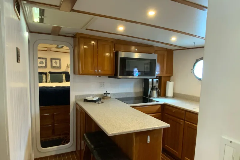 Slide: The Image of 2008 Great Harbour N37 yacht kitchen with wooden cabinets and modern appliances. - 7
