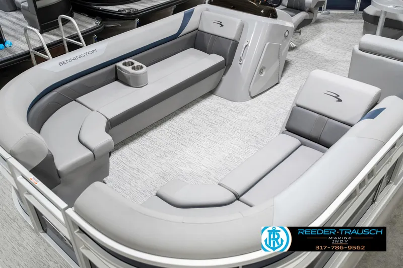 Slide: The Image of 2025 Bennington 22 SXL boat interior with gray seating and modern design. - 12