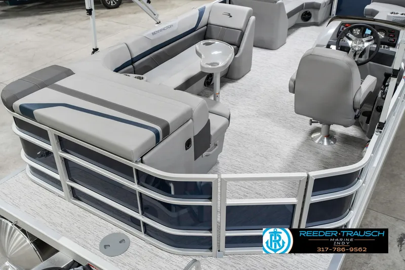 Slide: The Image of 2025 Bennington 22 SXL pontoon boat interior with seating and steering console. - 14