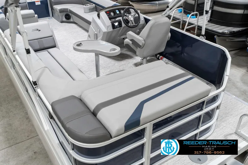 Slide: The Image of 2025 Bennington 22 SXL pontoon boat interior with seating and steering console. - 15