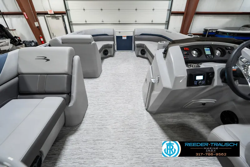 Slide: The Image of 2025 Bennington 22 SXL pontoon boat interior with modern seating and control panel. - 20