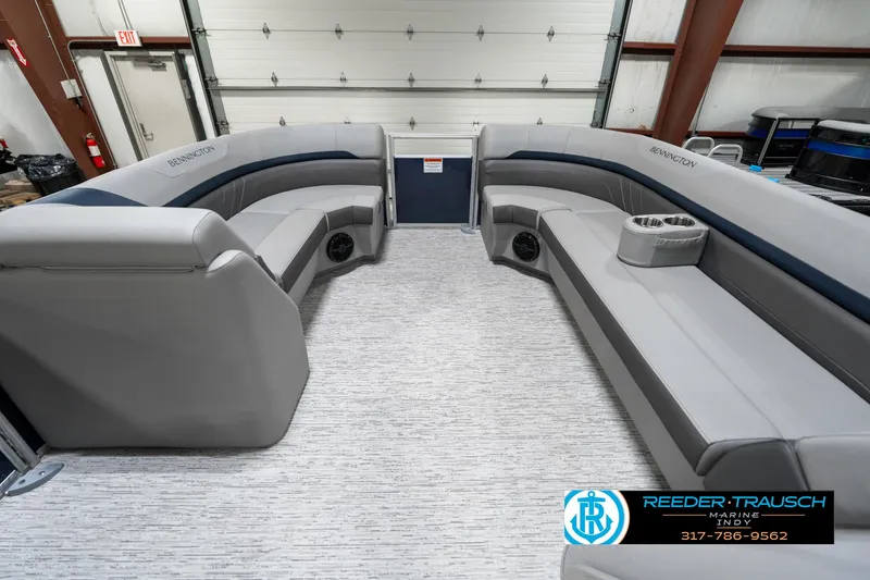 Slide: The Image of 2025 Bennington 22 SXL pontoon boat interior with gray seating and cup holders. - 21
