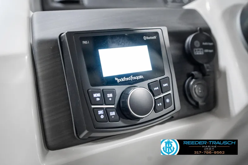 Slide: The Image of 2025 Bennington 22 SXL boat dashboard with Rockford Fosgate Bluetooth stereo system. - 35