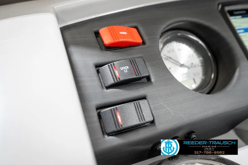 Slide: The Image of Control panel of 2025 Bennington 22 SXL boat with switches and gauge. - 36