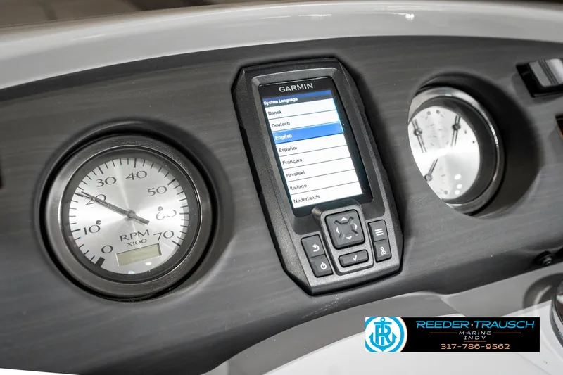 Slide: The Image of Dashboard of 2025 Bennington 22 SXL with Garmin display and RPM gauge. - 37
