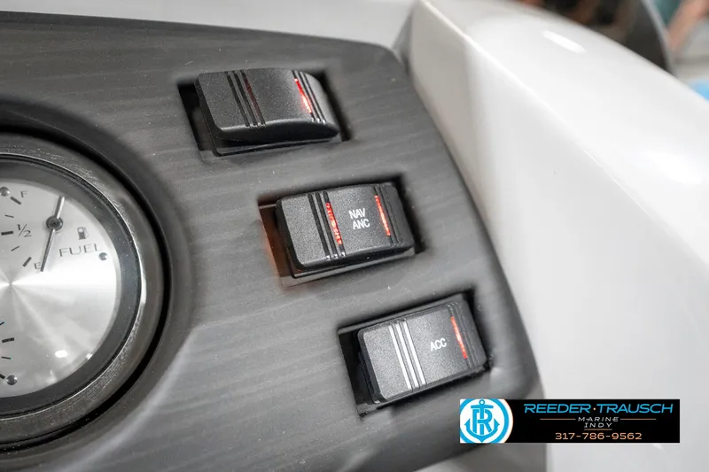 Slide: The Image of Dashboard controls of 2025 Bennington 22 SXL boat with fuel gauge and switches. - 38