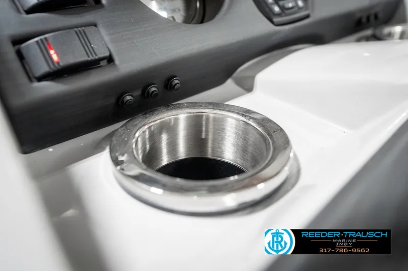 Slide: The Image of 2025 Bennington 22 SXL boat dashboard with stainless steel cup holder. - 46
