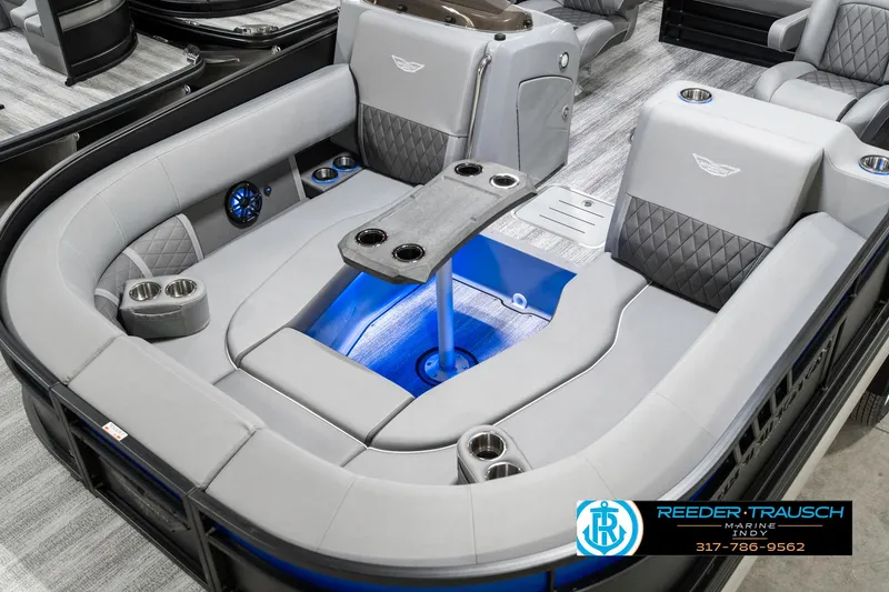 Slide: The Image of 2025 Bennington 23 LTSB pontoon boat interior with luxurious seating and cup holders. - 12