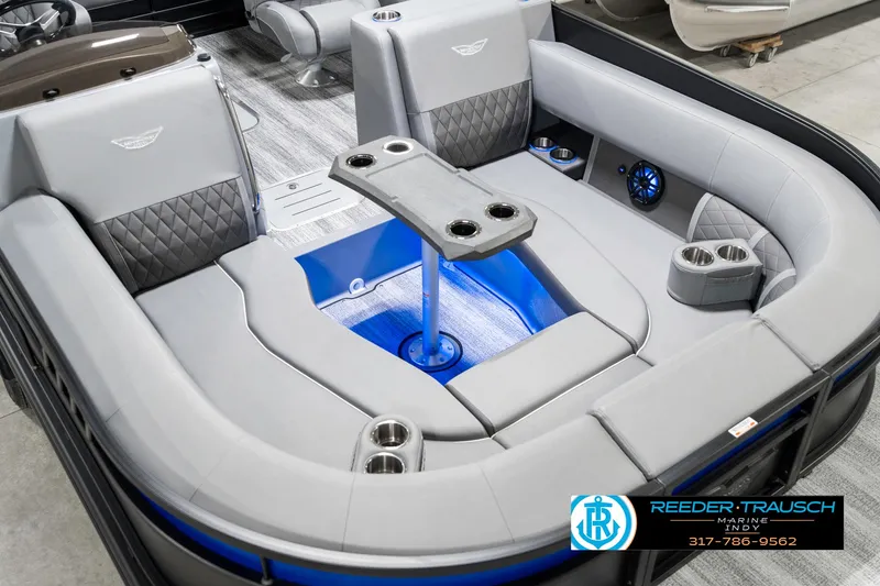 Slide: The Image of 2025 Bennington 23 LTSB boat interior with gray seating and blue LED lighting. - 13