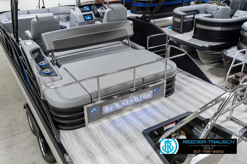 Slide: The Image of 2025 Bennington 23 LTSB pontoon boat with luxurious seating and modern dashboard. - 15
