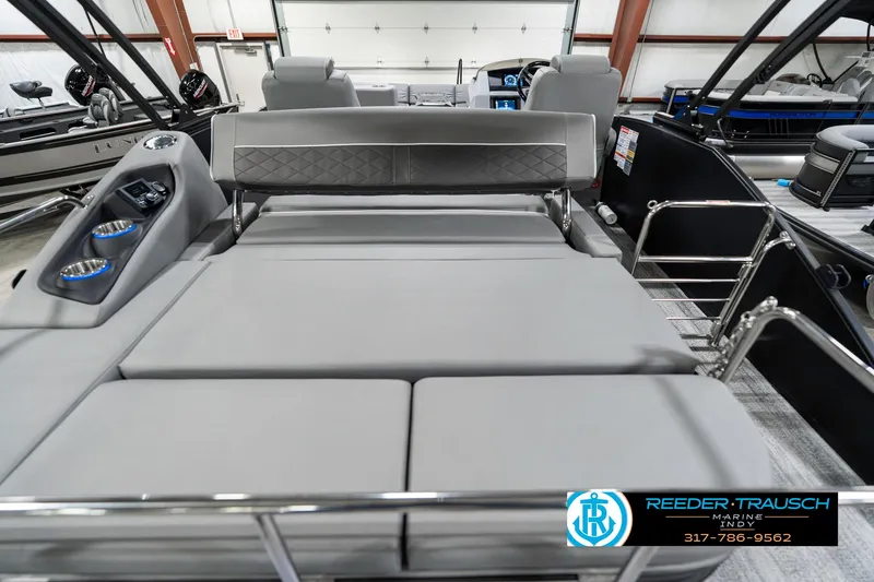 Slide: The Image of 2025 Bennington 23 LTSB boat interior with gray seating and cup holders. - 19