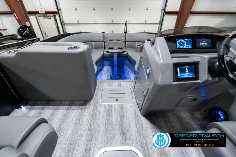 Slide: The Image of 2025 Bennington 23 LTSB boat interior with modern dashboard and seating. - 20
