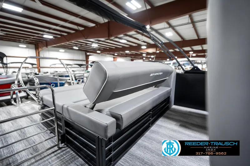 Slide: The Image of 2025 Bennington 23 LTSB pontoon boat interior with gray seating in showroom. - 27