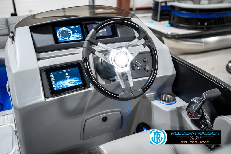 Slide: The Image of 2025 Bennington 23 LTSB boat dashboard with modern controls and digital displays. - 32