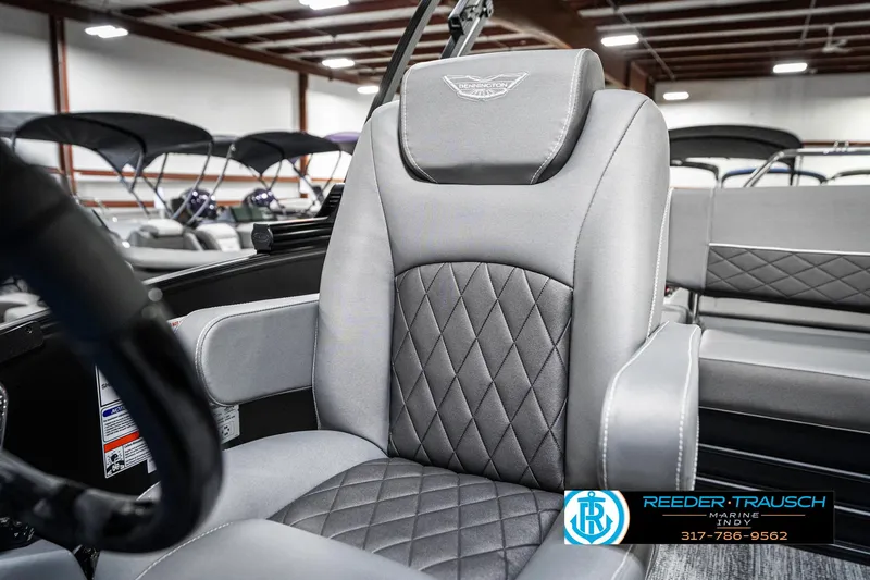 Slide: The Image of 2025 Bennington 23 LTSB boat interior with luxurious gray seating and diamond stitching. - 38