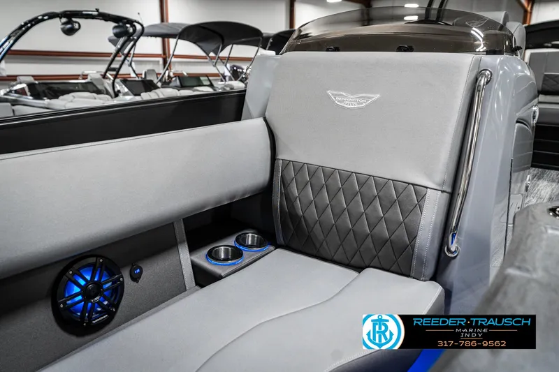 Slide: The Image of 2025 Bennington 23 LTSB boat interior with luxury seating and blue-lit speaker. - 39