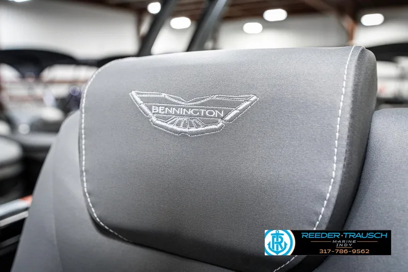 Slide: The Image of 2025 Bennington 23 LTSB boat seat with logo, showcased indoors. - 42