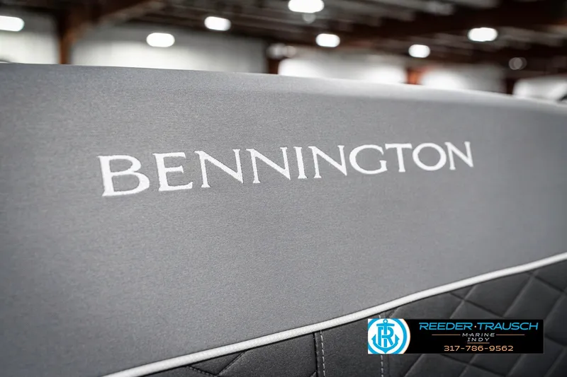 Slide: The Image of 2025 Bennington 23 LTSB boat seat with logo, featuring quilted upholstery. - 43