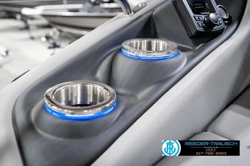 Slide: The Image of 2025 Bennington 23 LTSB boat console with illuminated cup holders and control panel. - 46