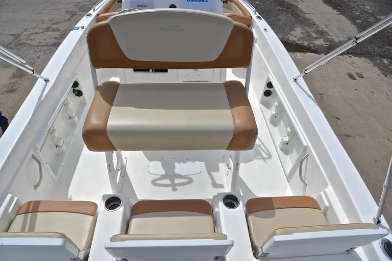 Slide: The Image of 2023 NauticStar 211 Hybrid boat interior with tan and white seating arrangement. - 18