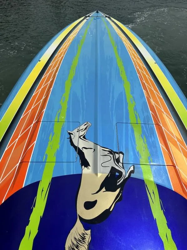Slide: The Image of 2008 Outerlimits 39 Quattro boat with vibrant, colorful graphics featuring a horse design. - 23