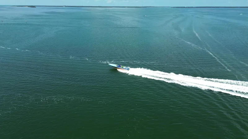 Slide: The Image of Aerial view of 2008 Outerlimits 39 Quattro speedboat cruising on open water. - 4