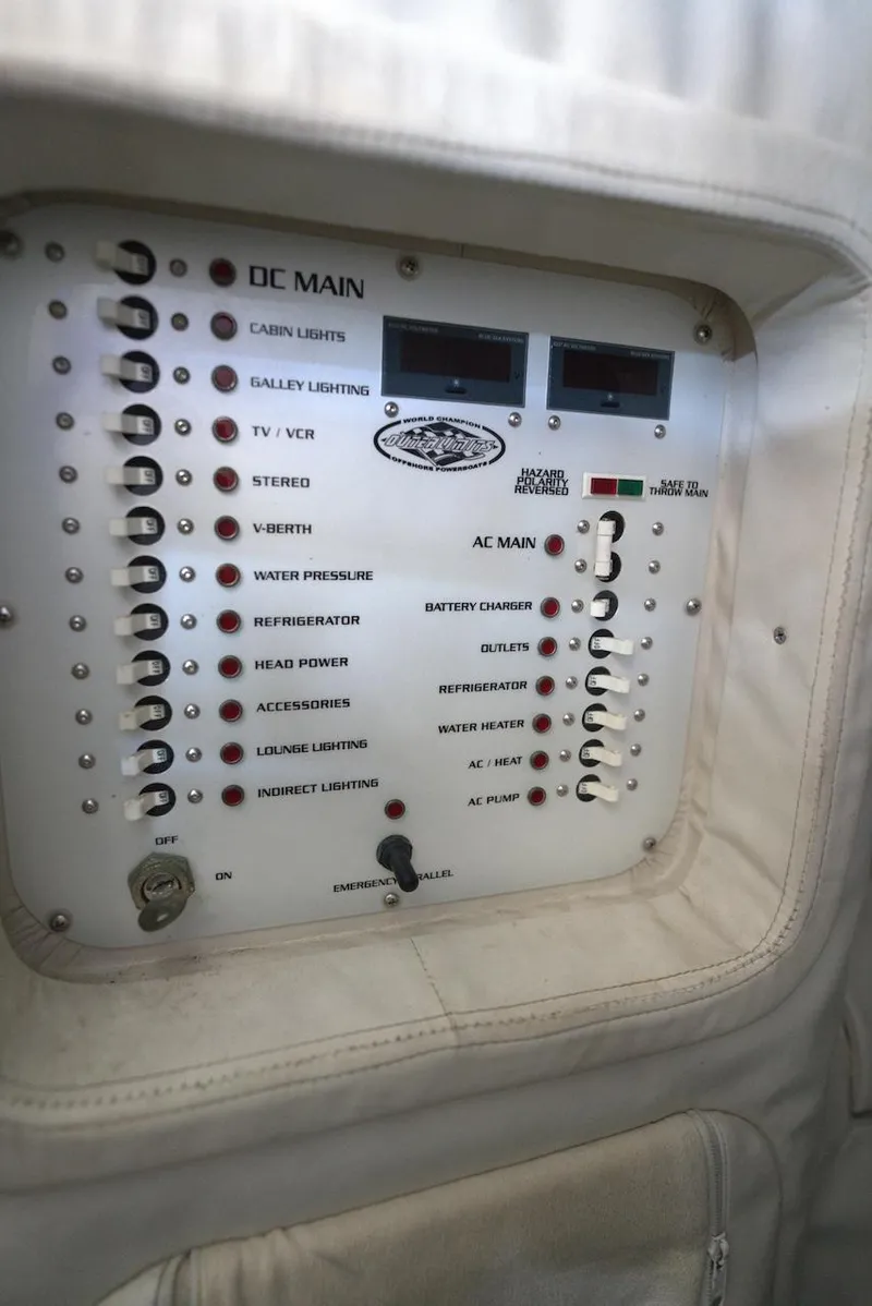 Slide: The Image of Control panel of 2008 Outerlimits 39 Quattro boat with various switches and indicators. - 41