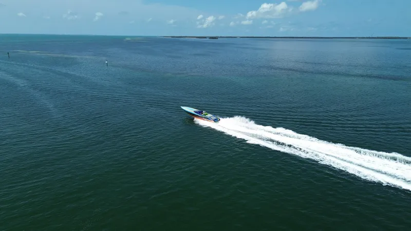 Slide: The Image of Aerial view of 2008 Outerlimits 39 Quattro speedboat cruising on open water. - 8