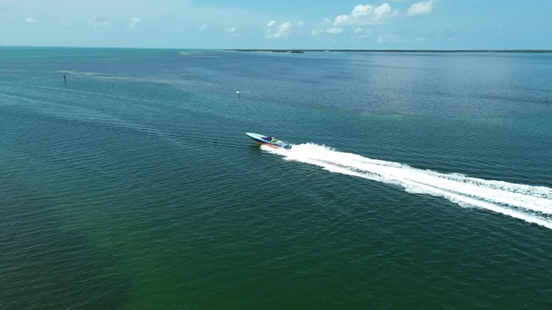 Slide: The Image of Aerial view of 2008 Outerlimits 39 Quattro speedboat cruising on open water. - 9